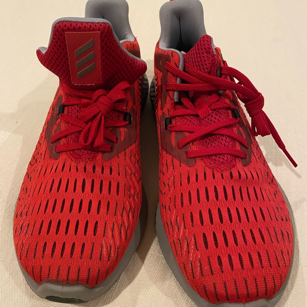 Never been worn Men’s red adidas sneakers!